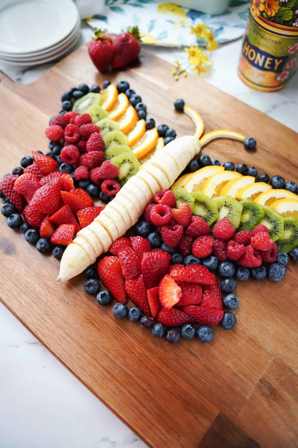 butterfly fruit platter on serving board