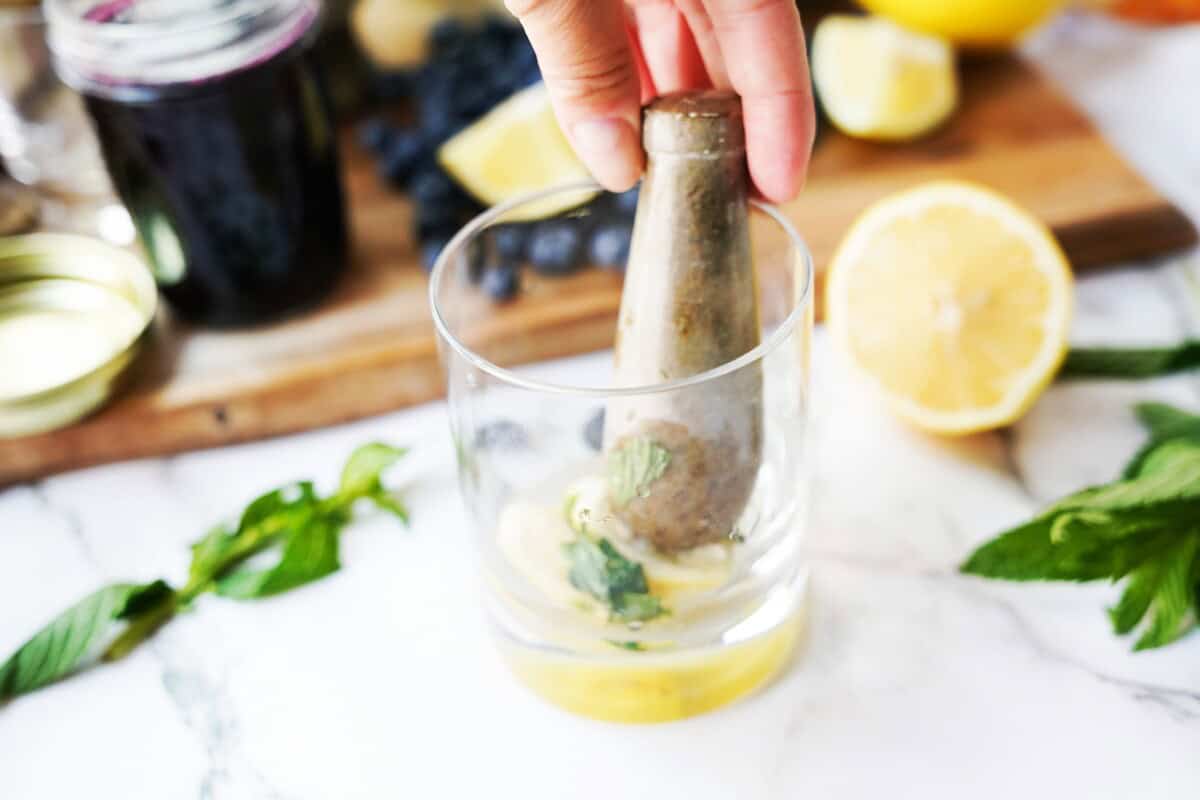 Muddled lemon wedges and fresh mint.