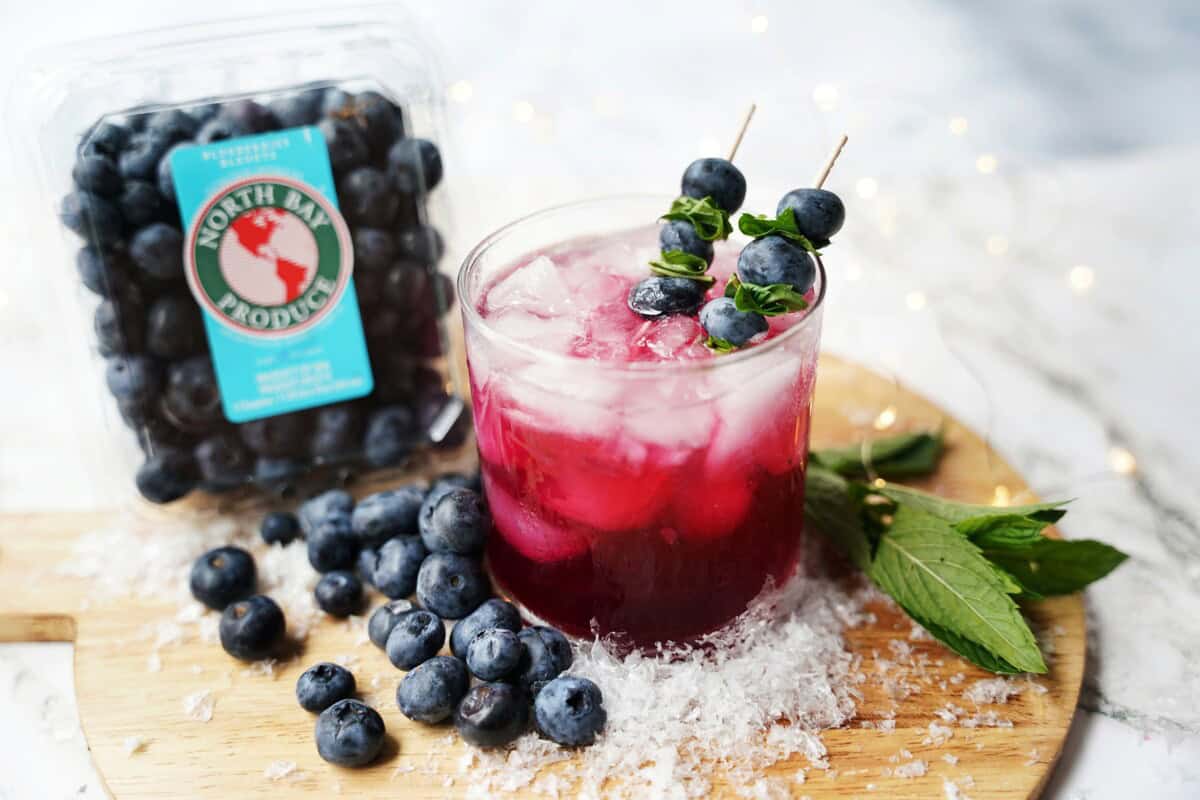 Blueberry and mint garnish.