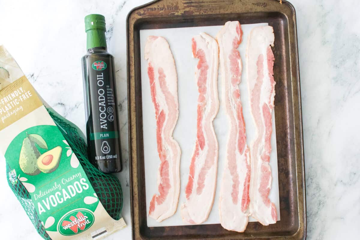 bacon on baking sheet with parchment paper