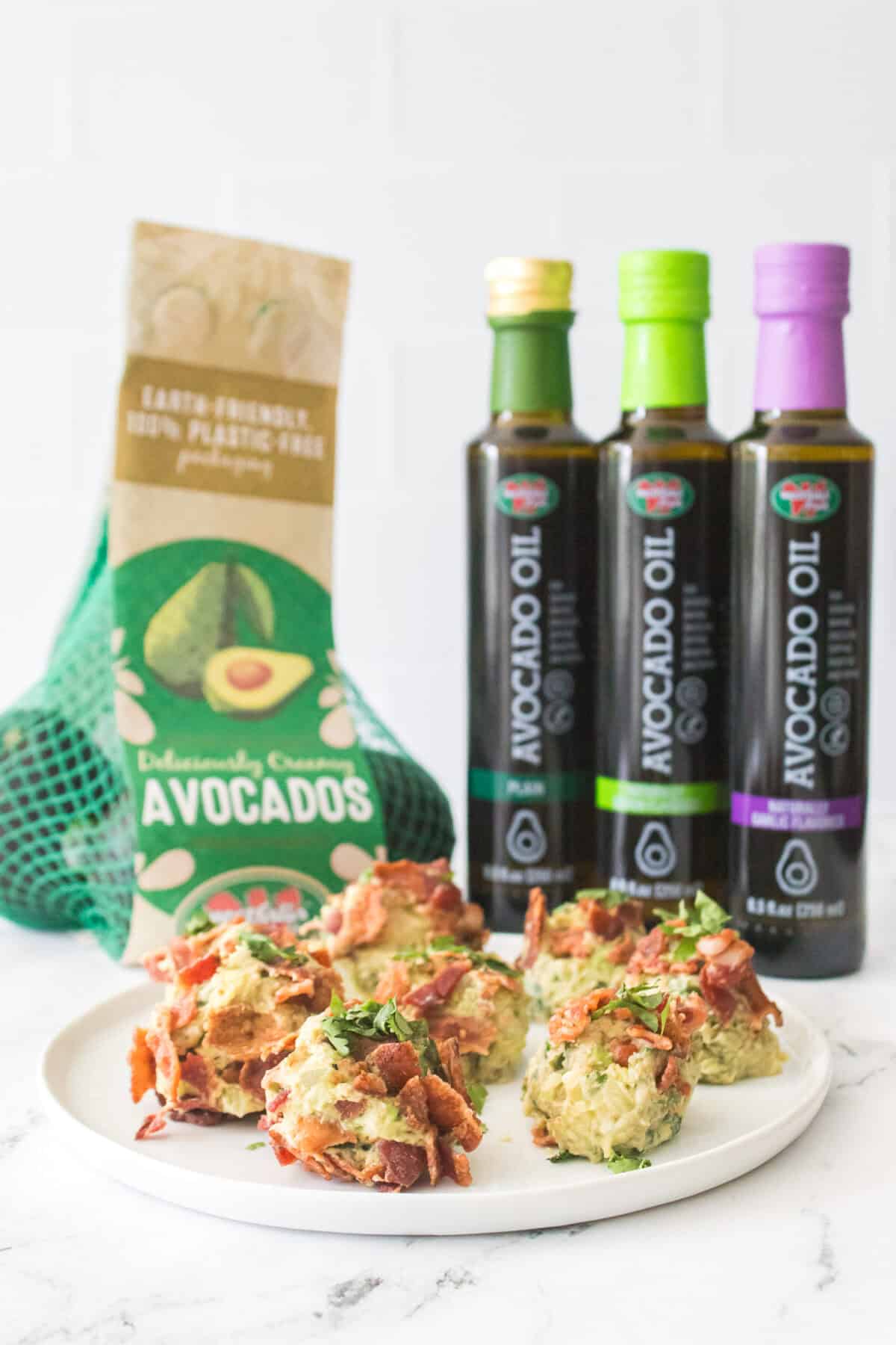 head on shot of bacon guacamole bombs on white plate