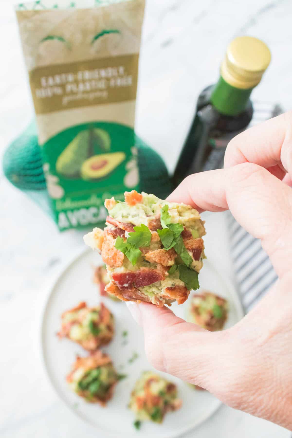 hand holding a bacon guacamole fat bomb