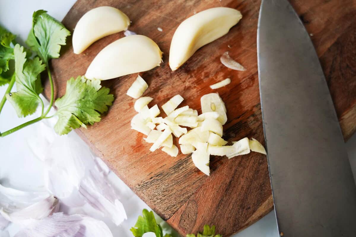 Cut Garlic on cutting board