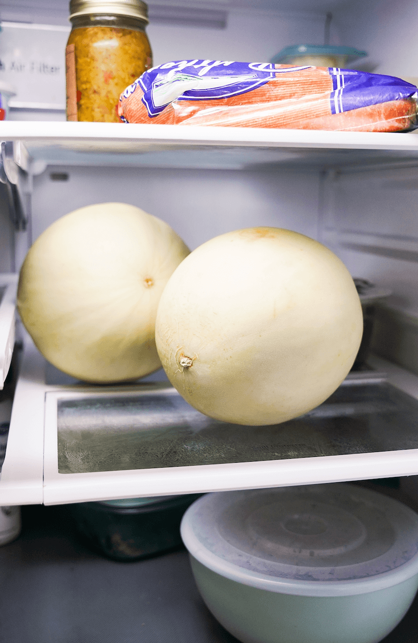 2 Honeydew Melons whole in fridge