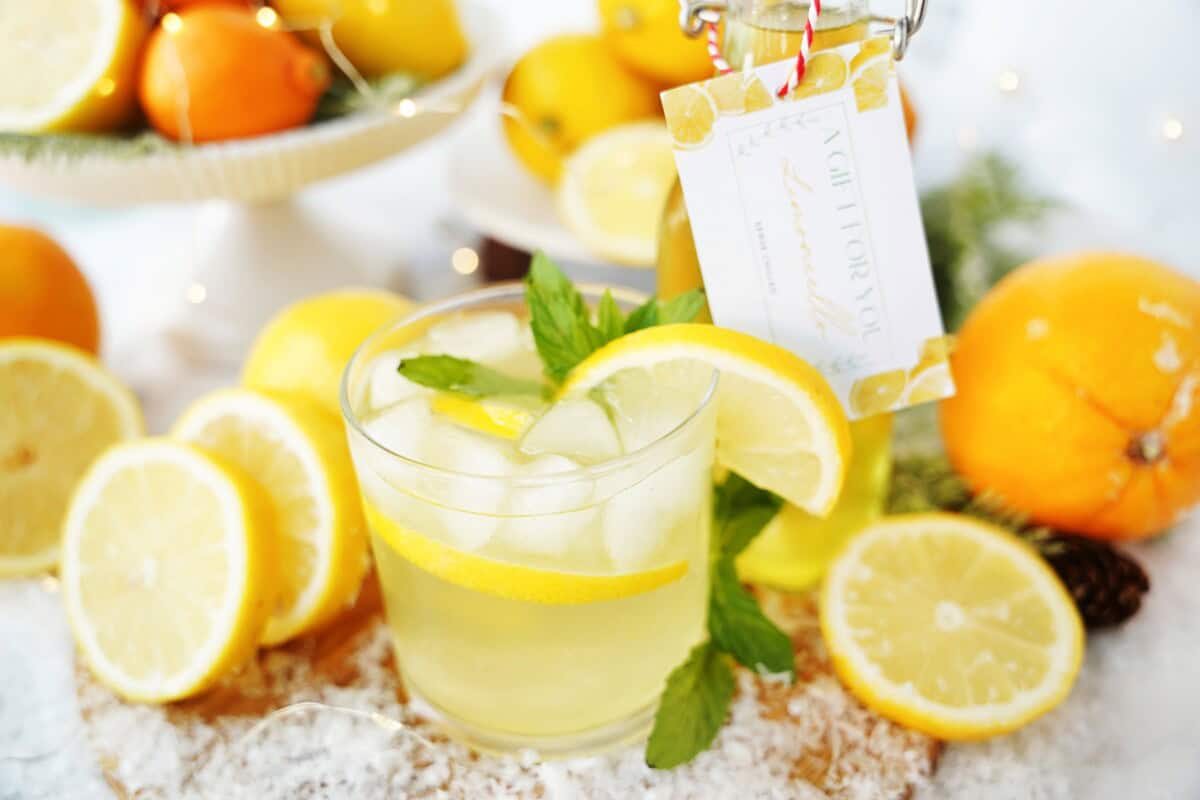 Limoncello served in a glass with fresh mint and a lemon slice.