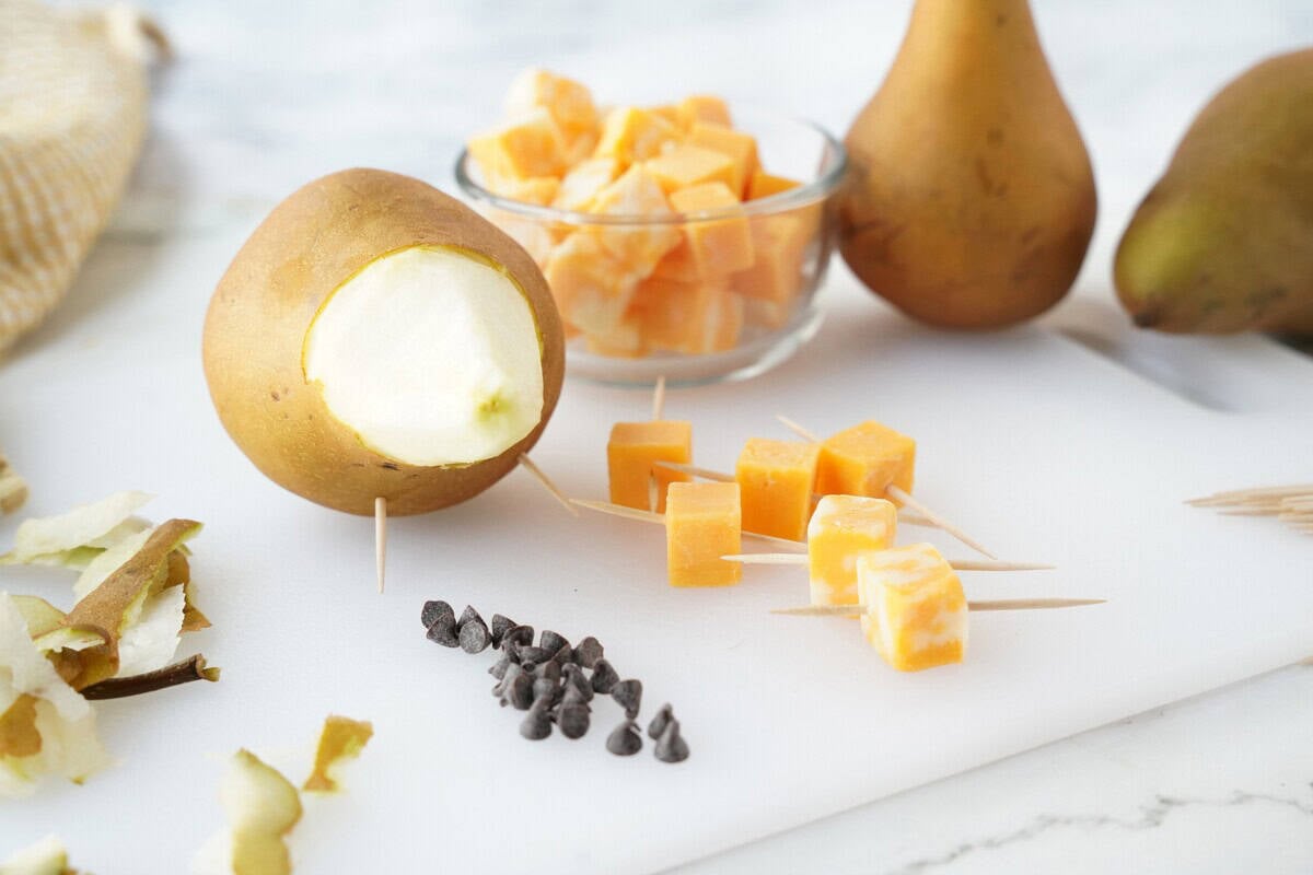 Insert the toothpicks into the cheese cubes and insert into the pear.