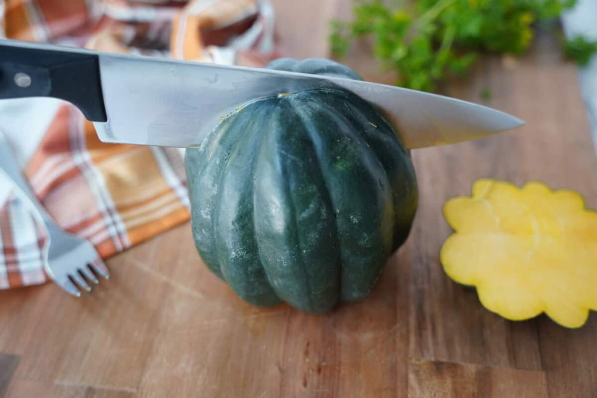 Slicing down the middle acorn squash