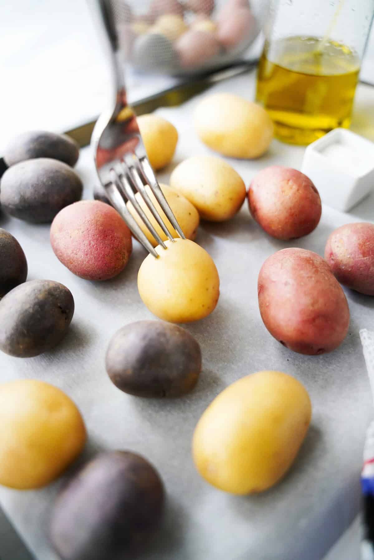 Poke the potatoes with a fork.