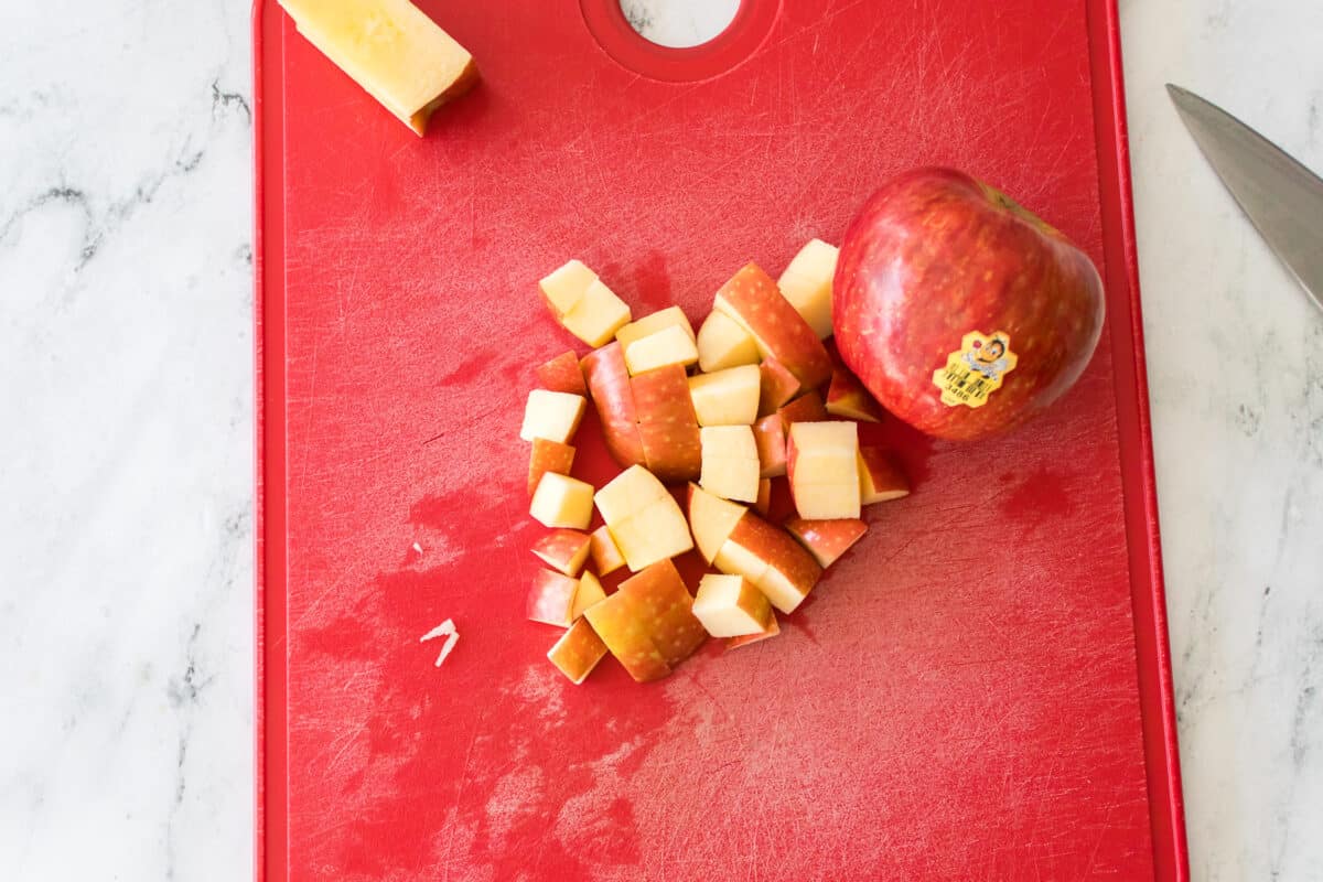 sugarbee apple diced on red cutting board