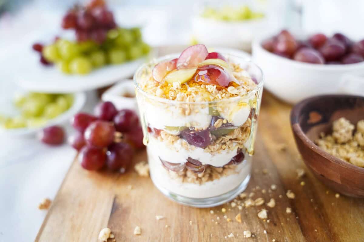 Close up Grape Greek Yogurt Parfait with grapes in the background