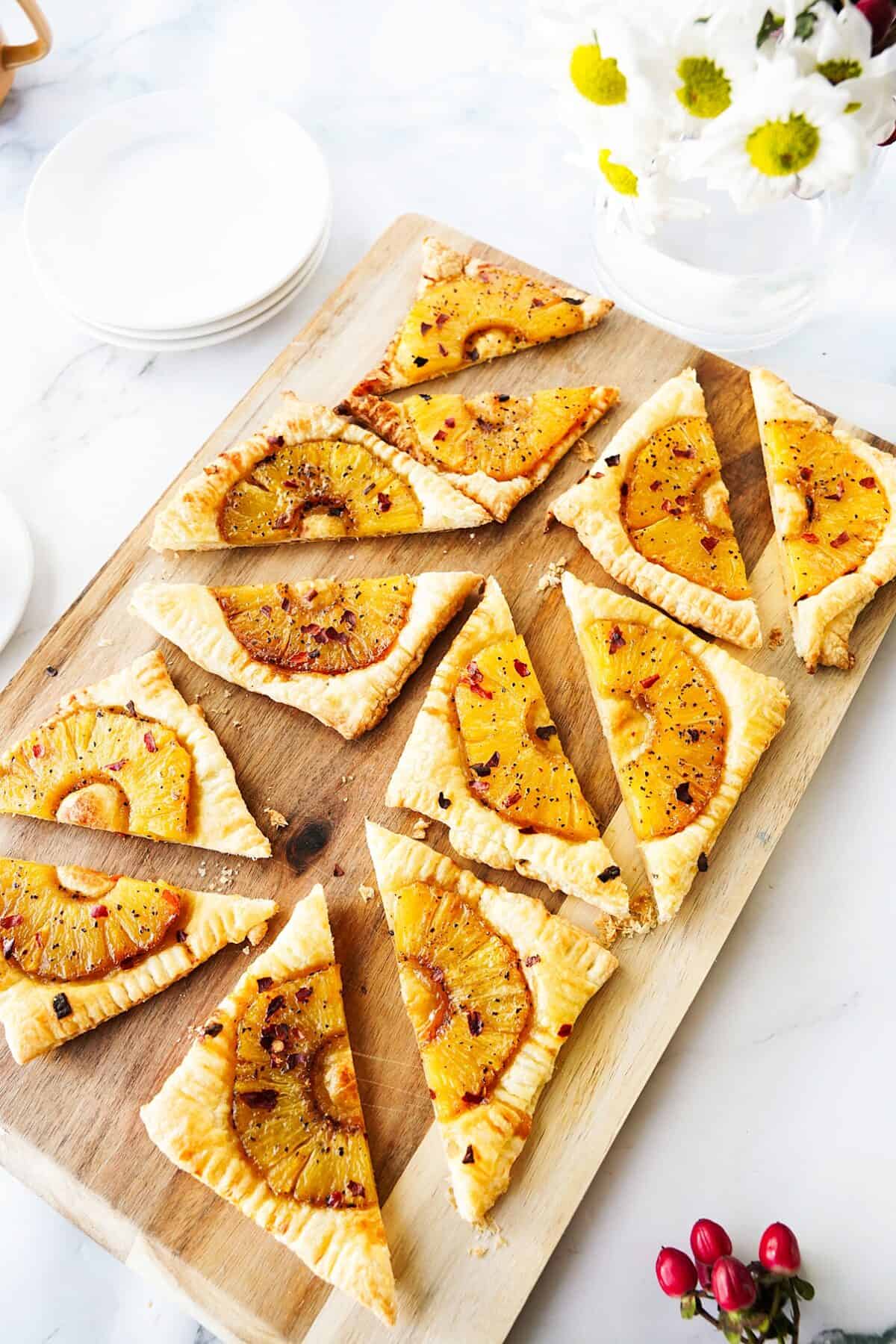 overhead shot of spicy pineapple tarts cut into triangles