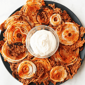 Crispy Onion Chips on platter with dip