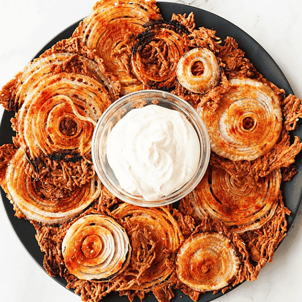 Crispy Onion Chips on platter with dip