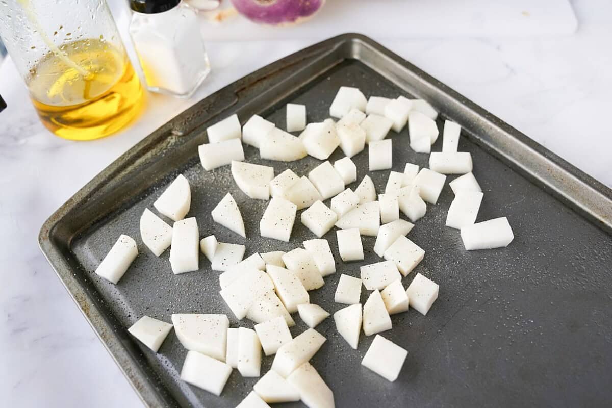 cut turnips on baking sheet