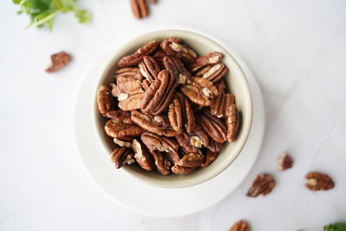 Overhead Toasted Pecans in White Bowl