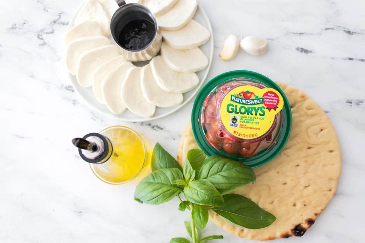 overhead shot of ingredients to make caprese flatbread