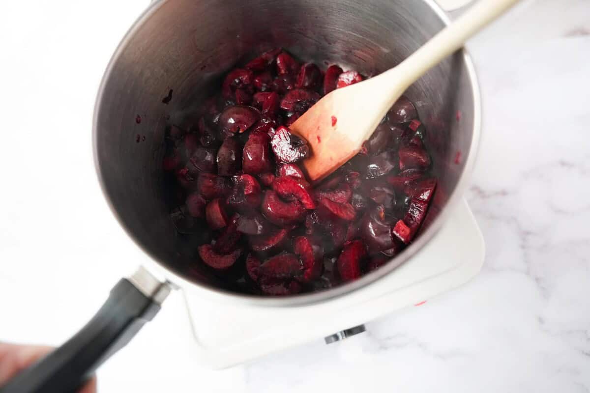 Cherries cooked in a pot on the stove