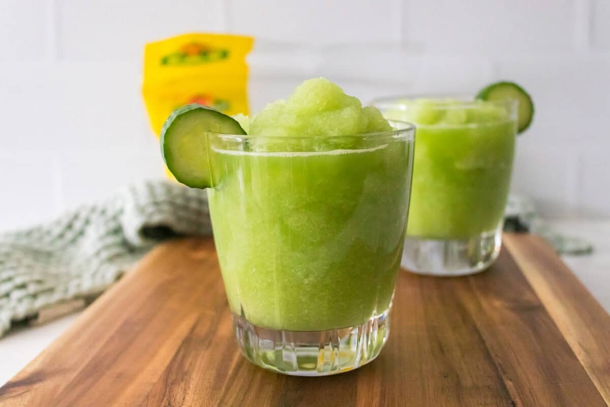 head on shot of cucumber slushie garnished with cucumber slice