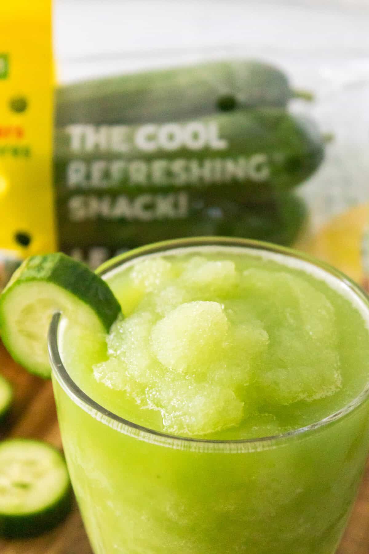 close up shot of cucumber slushie garnished with cucumber slice
