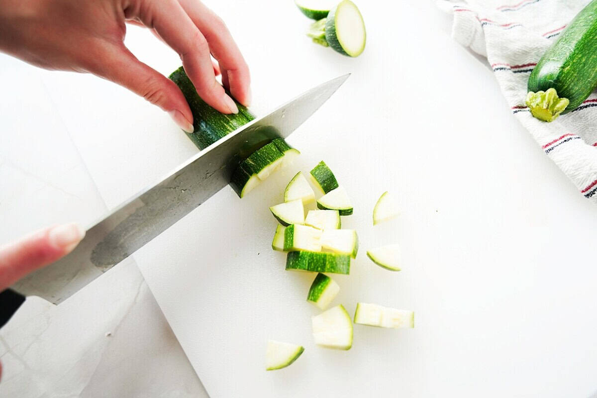 Cut Zucchini Diced on white board