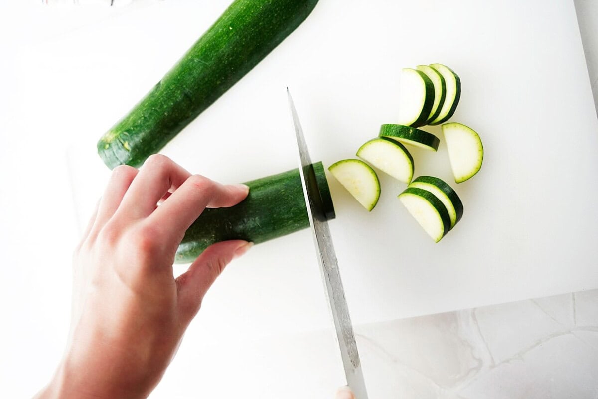 Half moon zucchini cuts on white board
