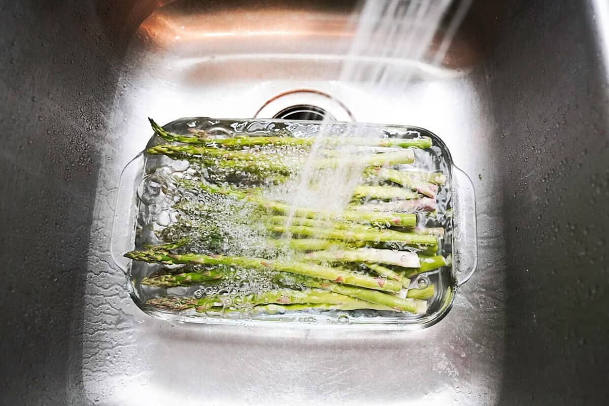 Rinsing Asparagus in sink