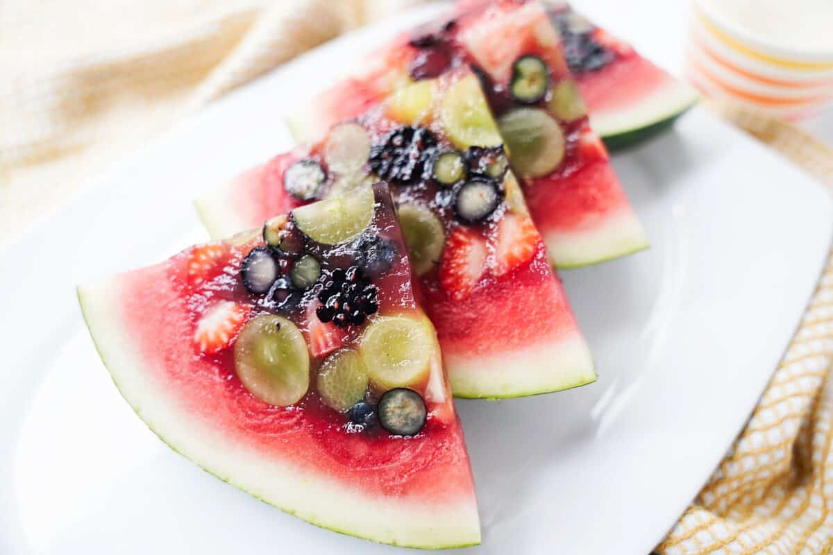 watermelon slices with fresh fruit inside with jello