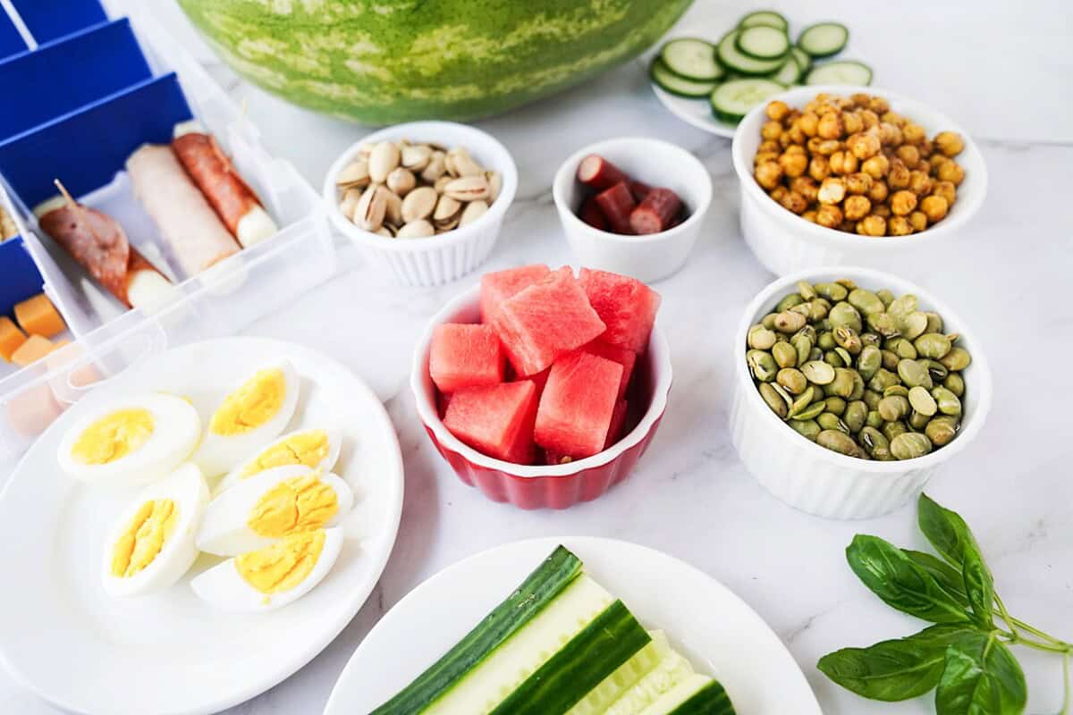 Cubed watermelon, hard-boiled eggs, cucumber sticks, nuts