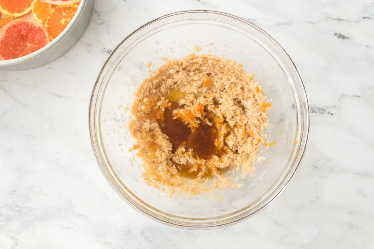 sugar, butter and light brown sugar creamed together with orange juice, orange zest and vanilla extract before mixing in a glass bowl