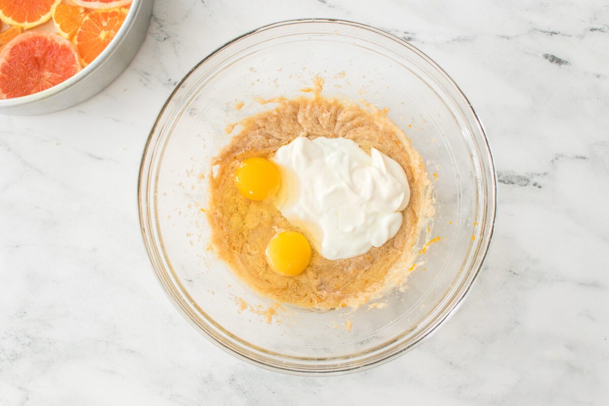 sugar, butter and light brown sugar orange juice, orange zest and vanilla extract creamed together with yogurt and two eggs before mixing in a glass bowl