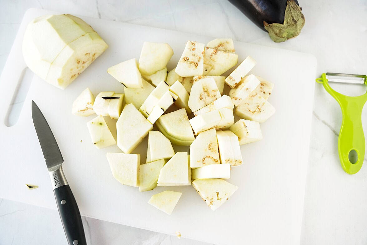 1" pieces of eggplant on cutting board