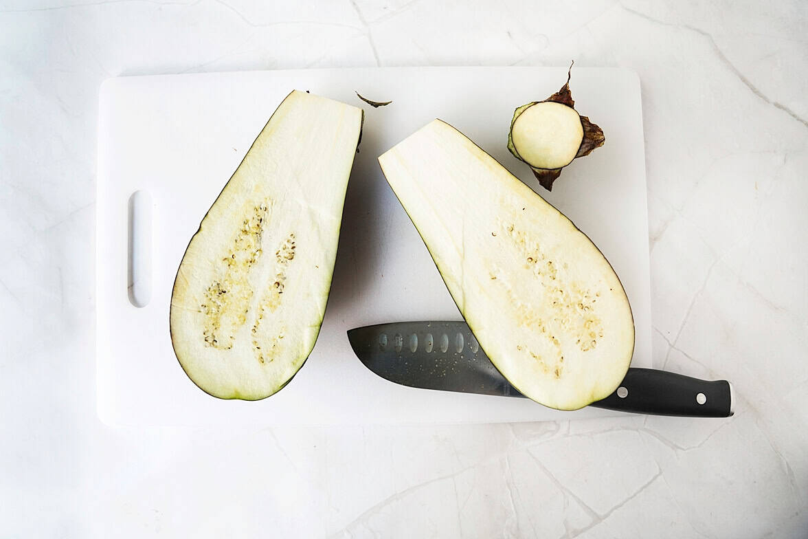 eggpant cut in half on cutting board