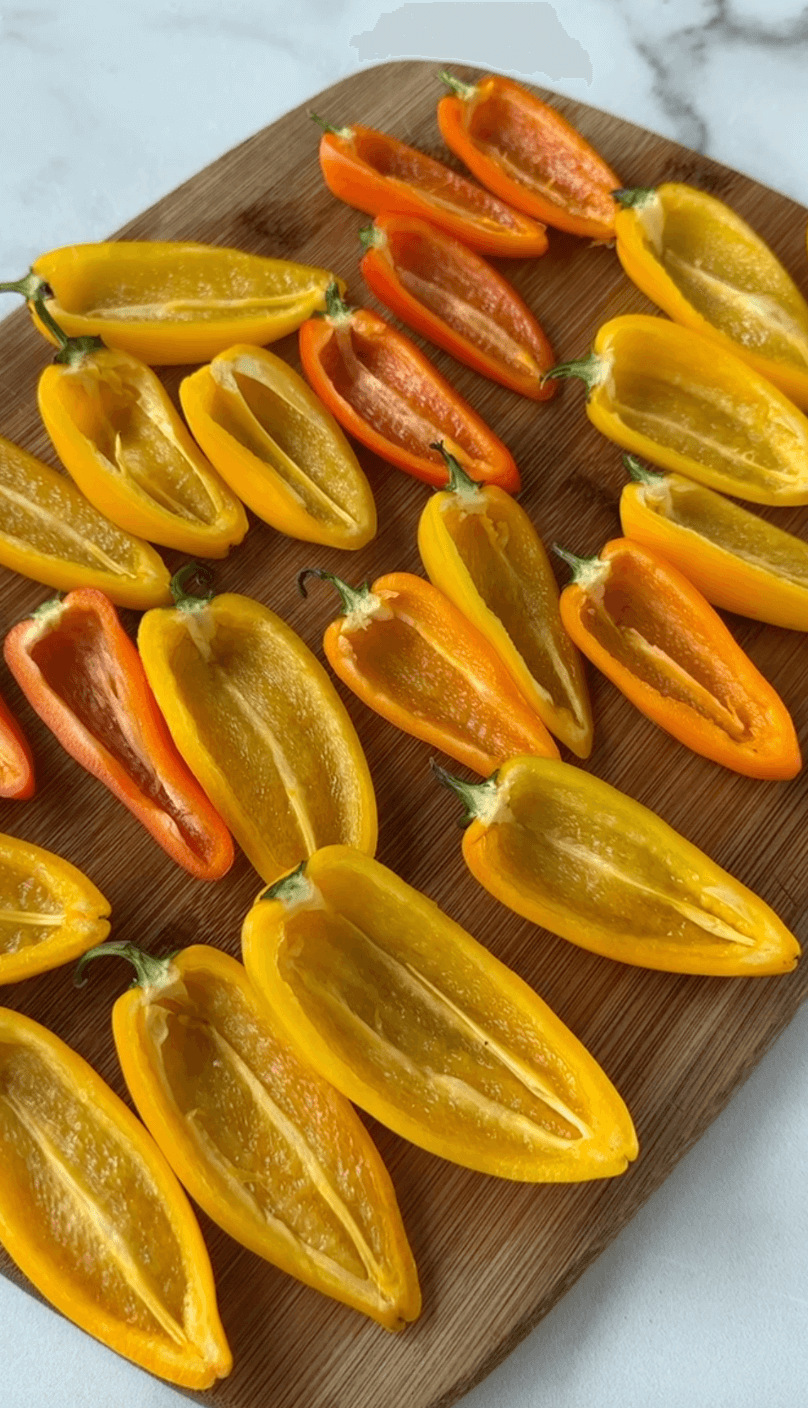 vertical image of sliced mini bell peppers