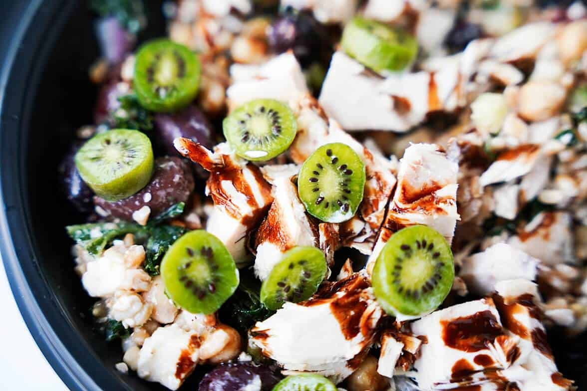 A salad with halfved kiwi berries