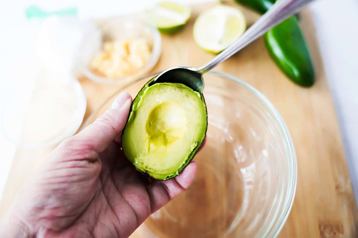 Scooping out the Westfalia Fruit avocado and adding to glass bowl