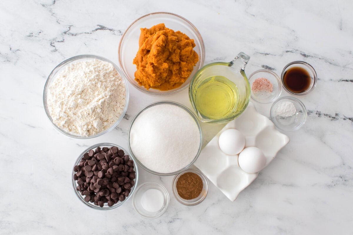 ingredients for Pumpkin bread: vegetable oi, sugar, eggs, vanilla extract, pumpkin puree flour, chocolate chips, cinnamon, baking powder, baking soda, salt