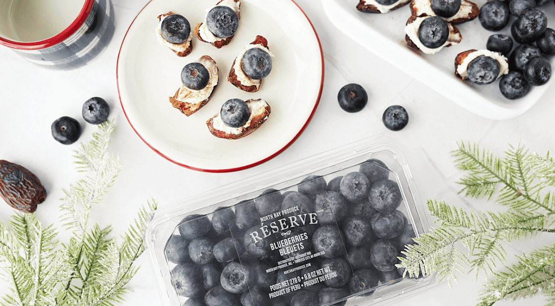 Blueberry mascarpone stuffed dates on a plate with North Bay Reserve blueberry package ab the bottom