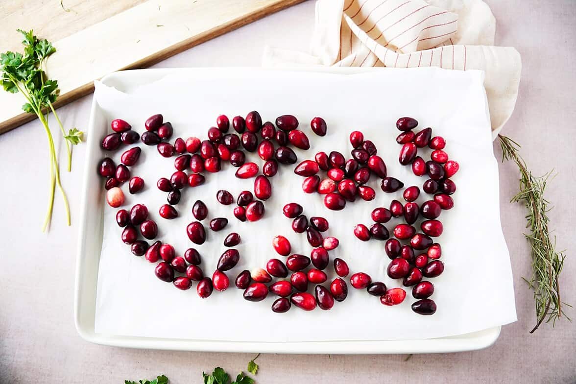 Cranberries in a single layer of a parchment-lined baking sheet