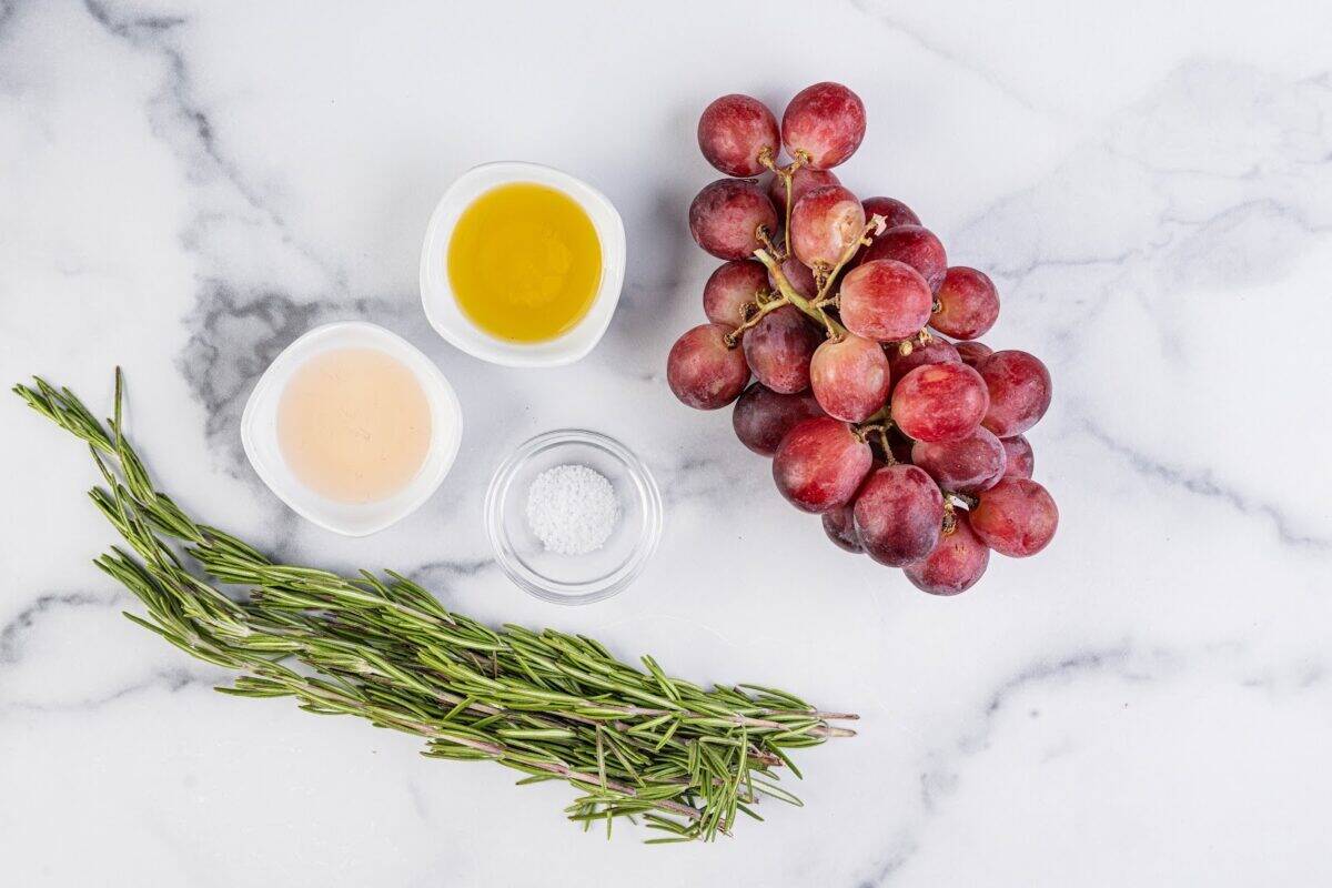 Table grapes, olive oil, sherry vinegar, salt and pepper, and rosemary sprigs