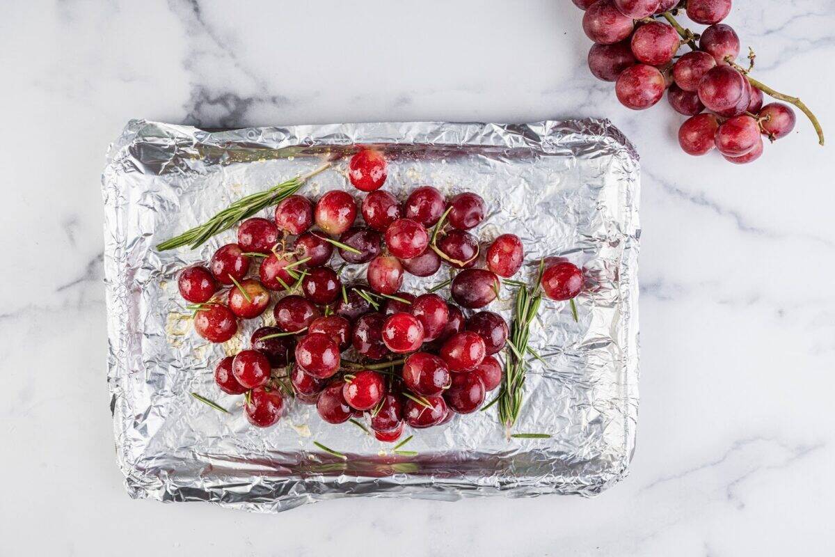 Seasoned grapes on a sheet pan