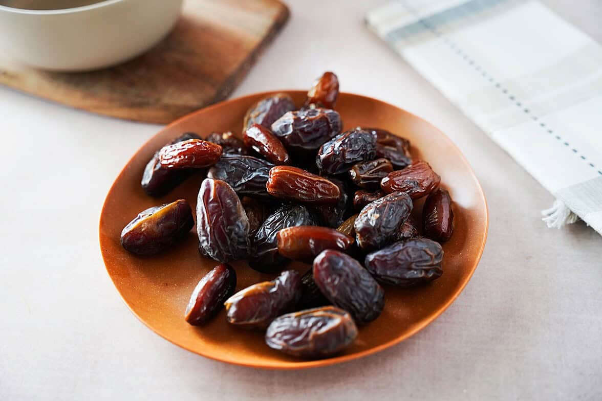 Dates in a brown bowl/plate