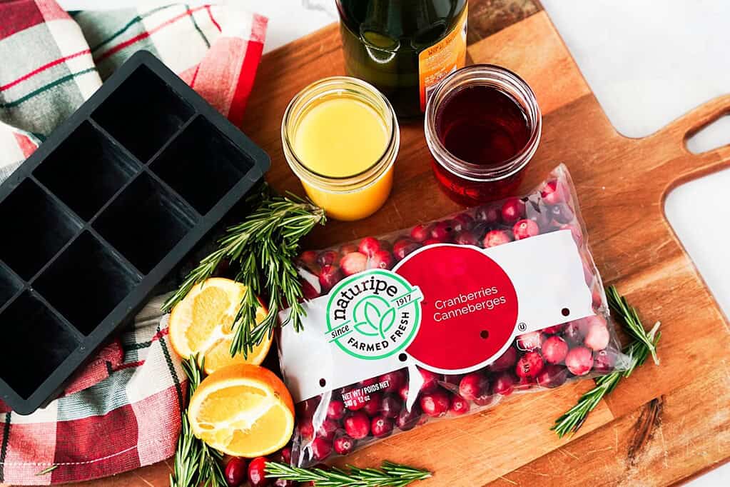 Ingredients Cranberry Orange Sparkler: Naturipe Cranberries, orange juice, cranberry juice, oranges, cranberries, rosemarry and bottle of champagne