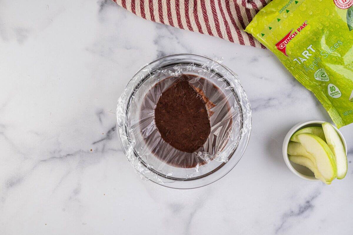 Melted chocolate covered with plastic wrap.