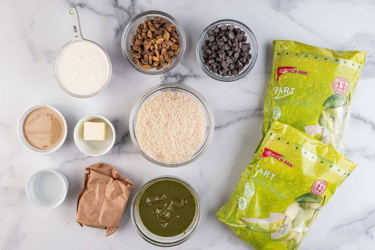 Apples, pistachio cream, kataifi, chocolate chips, cream, butter, and pistachios