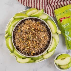 Dubai chocolate fruit dip with a bag of sliced apples