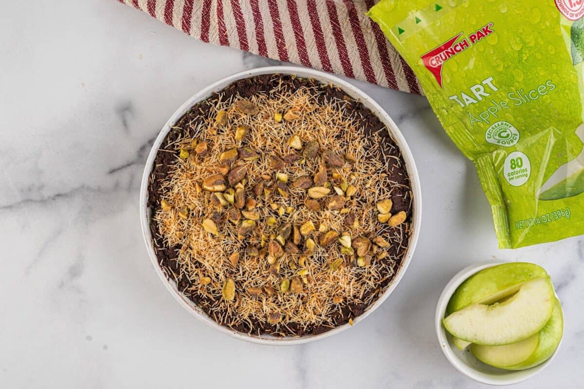 Dubai chocolate dip topped with kataifi, pistachios, and sea salt