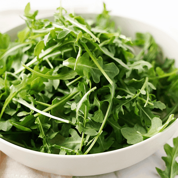 Arugula ina. white dish
