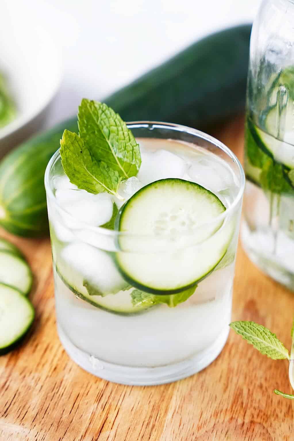 vertical image of cucumber water in clear glass