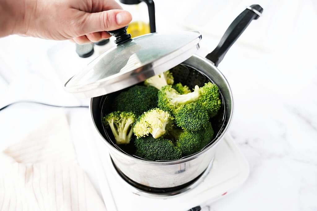 Broccoli in a pot getting steamed