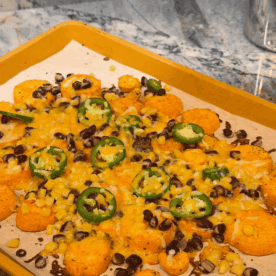 close up of sweet potato nachos on sheet pan